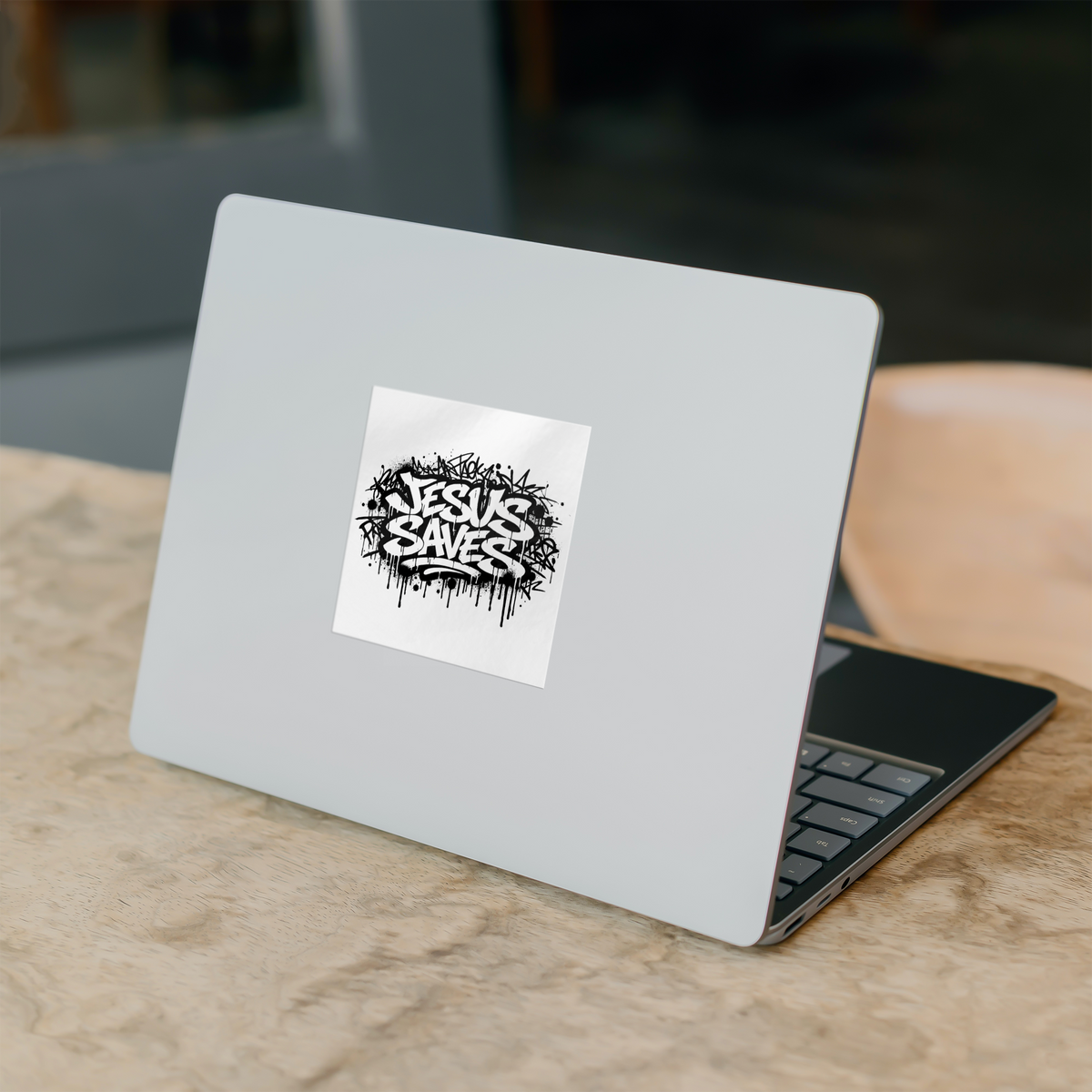 Jesus_Saves_Sticker__Christian_Faith_St_WhiteSquareSticker_Laptop_Mockup.png_16190604